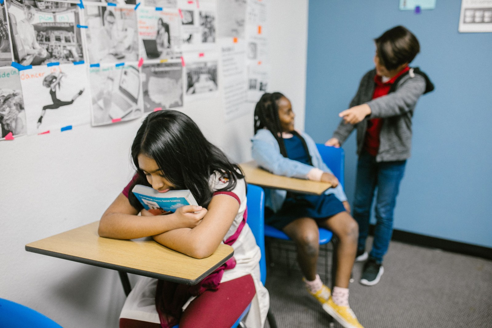 Staged classroom scene illustrating a child feeling excluded